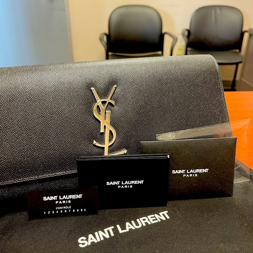 Brand new authentic Saint Laurent clutch.